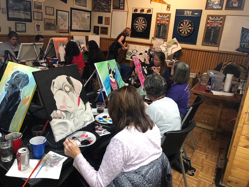 various patrons paint their beloved pets while enjoying fine brews from IJs